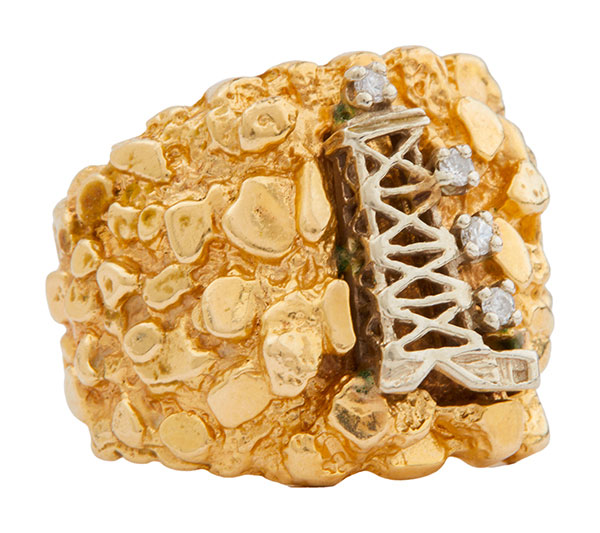 Dusty Hill's commissioned oil derrick gold nugget ring accented with four circular-cut diamonds